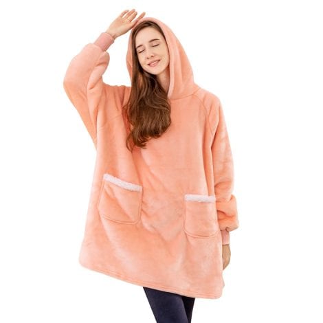 A cozy, oversized hoodie blanket for women in pink, perfect as a warm gift. (15 words)