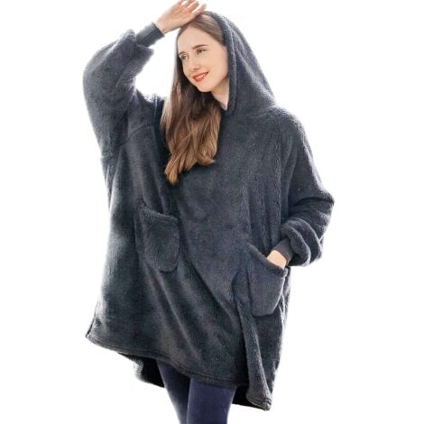 A cozy oversized hoodie blanket for women, perfect for winter, in grey with sleeves. Ideal gift for her.