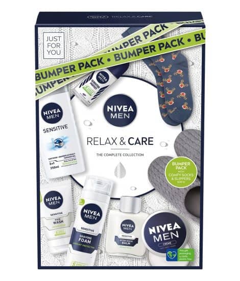 NIVEA MEN Pamper Collection (8 items) features grooming essentials & comfy accessories: shower gel, face wash, deodorant, moisturizer, shaving foam, aftershave balm, slippers, and socks.