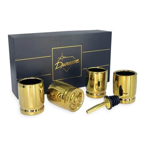 Set of 4 ceramic shot glasses shaped like 50 caliber bullet casings, perfect luxury gift for men.