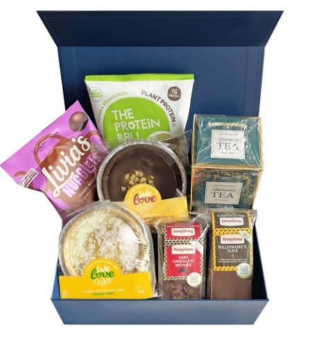 Vegan and gluten-free gift hamper perfect for tea time, including delicious cakes, tarts, chocolate treats, and tea. Suitable for any occasion, for both women and men.