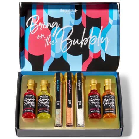 A delightful gift set of flavored toppers, shimmers and edible garnish for champagne and cocktails. (Does not include alcohol.)