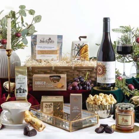 The ultimate Christmas gift bundle – Xmas hampers with luxurious goodies and a bottle of festive red wine.